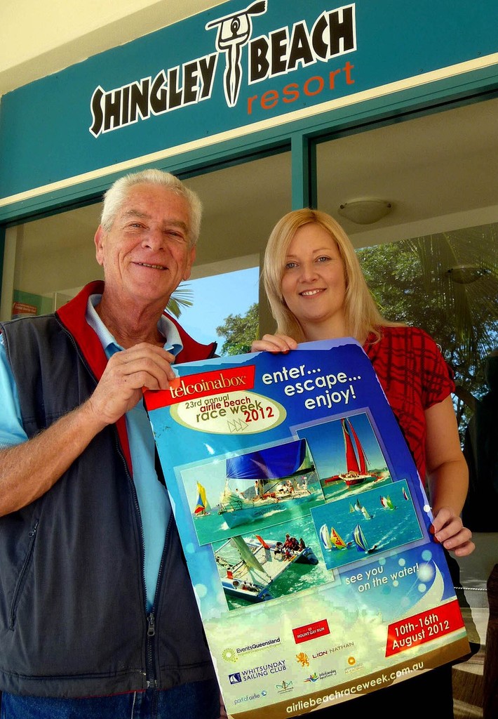 President of WSC Jeff Brown with Charmaine Trundle, assistant manager of Shingley Beach Resort, set about displaying posters. Photo: Bob Feeney - Telcoinabox Airlie Beach Race Week 2012 © Whitsunday Sailing Club